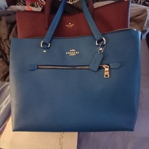 2 kate spade pocketbooks one black and one burgundy!!! 1 coach all blue.